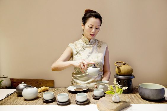 Green Tea: A Symbol of Harmony and Heritage in Japanese Life- Woman preparing green tea 